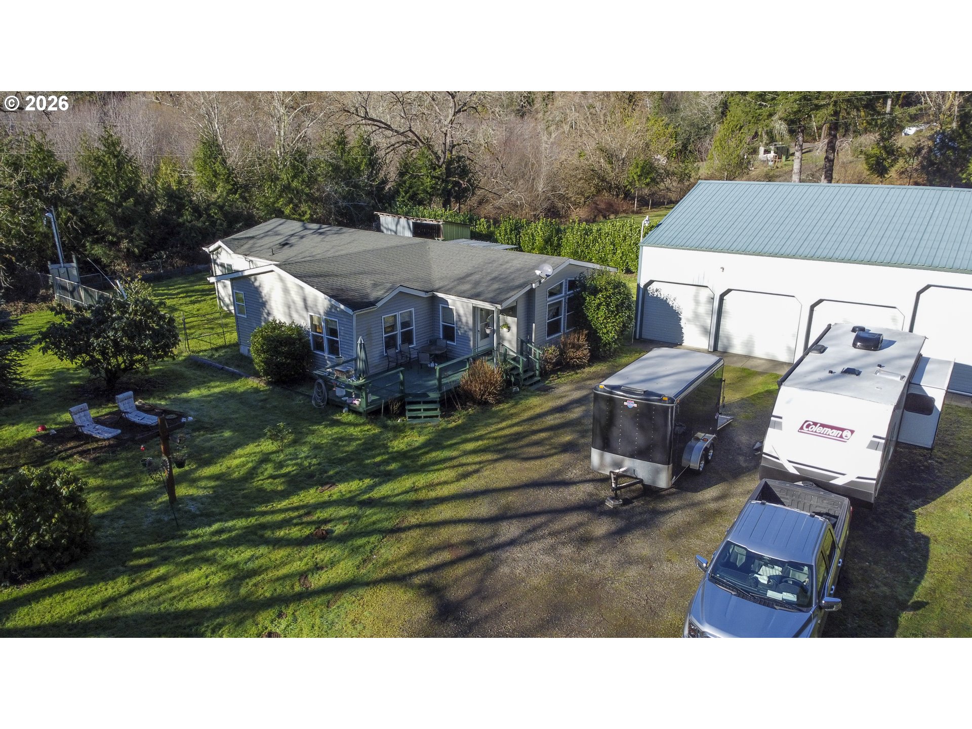 9580 North Fork Siuslaw Road Florence, OR 97439 - Photo 3 of 48 a aerial view of a house with a yard