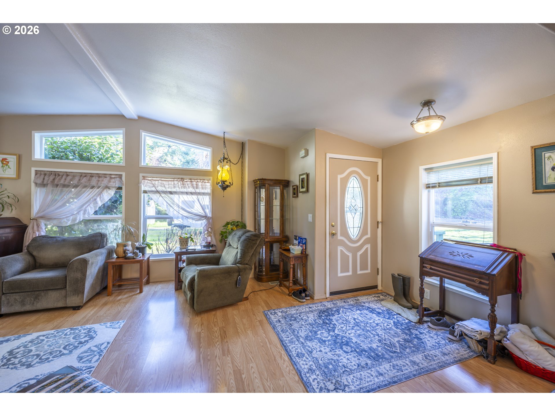 9580 North Fork Siuslaw Road Florence, OR 97439 - Photo 32 of 48 a living room with furniture windows and a wooden floor