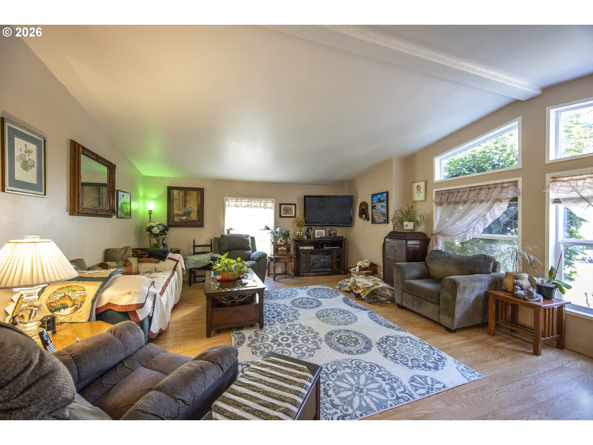 9580 North Fork Siuslaw Road Florence, OR 97439 - Photo 33 of 48 a living room with furniture and a large window