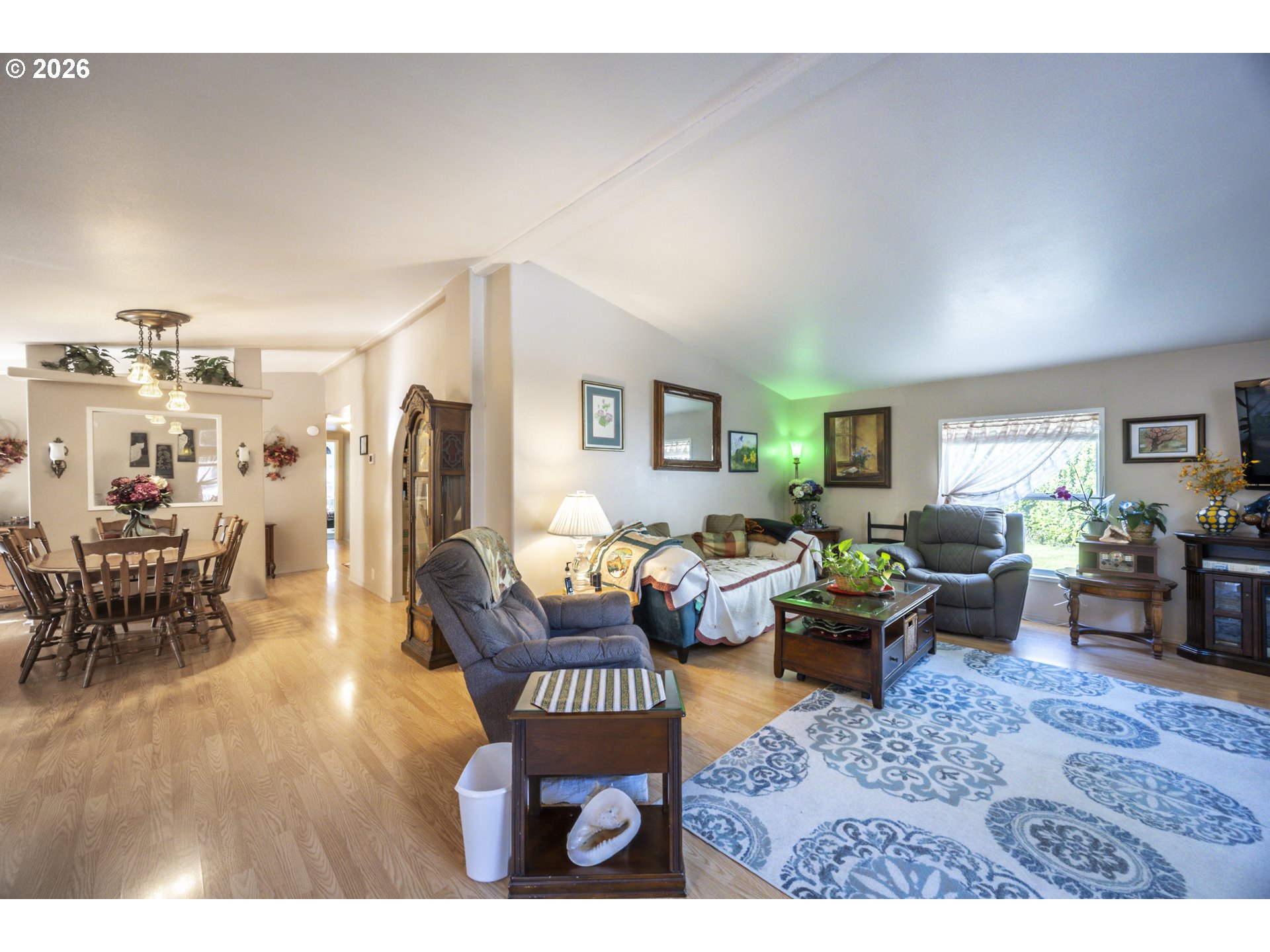9580 North Fork Siuslaw Road Florence, OR 97439 - Photo 34 of 48 a living room with furniture dining table and a window