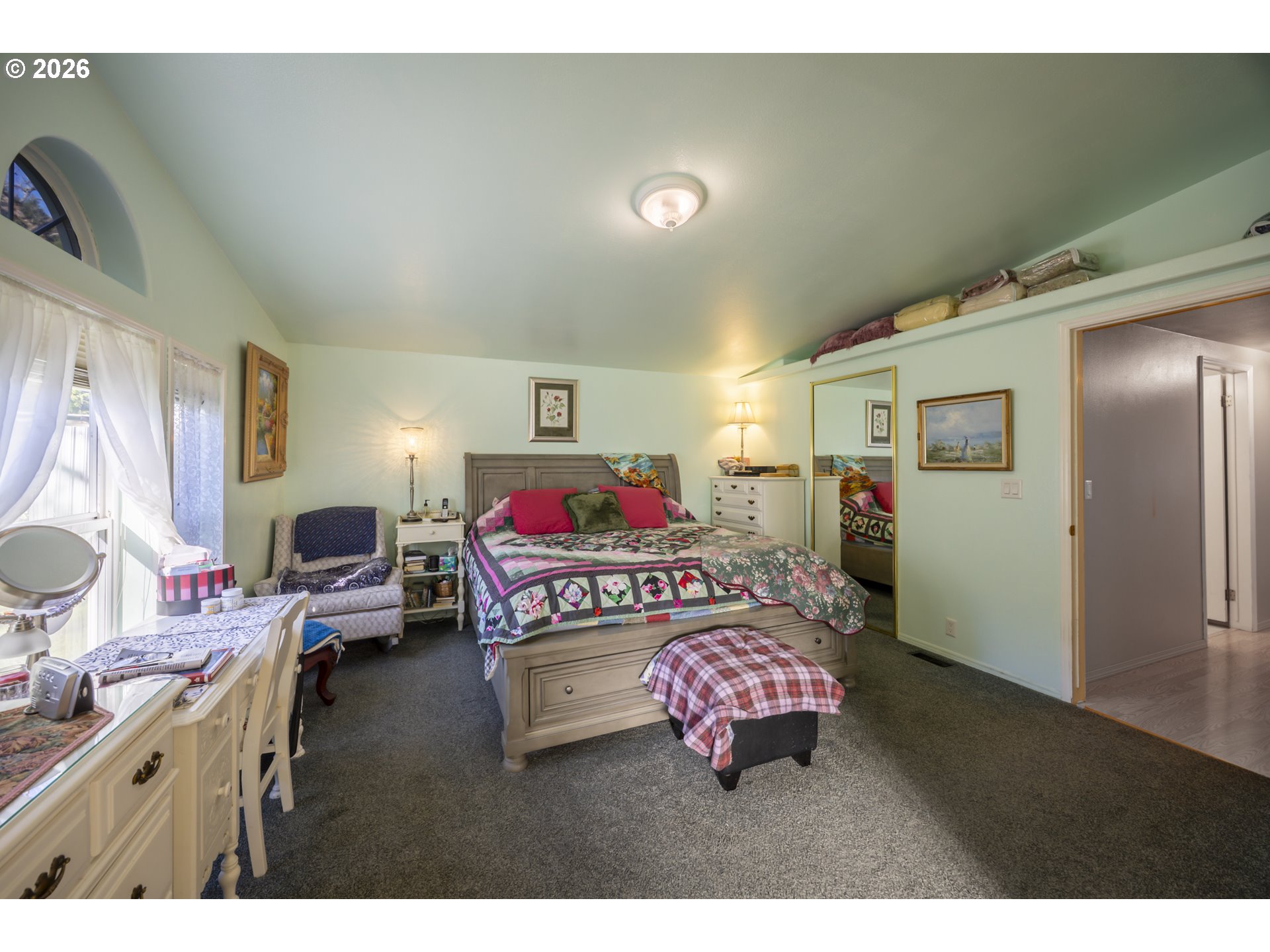 9580 North Fork Siuslaw Road Florence, OR 97439 - Photo 36 of 48 a bedroom with furniture and a window
