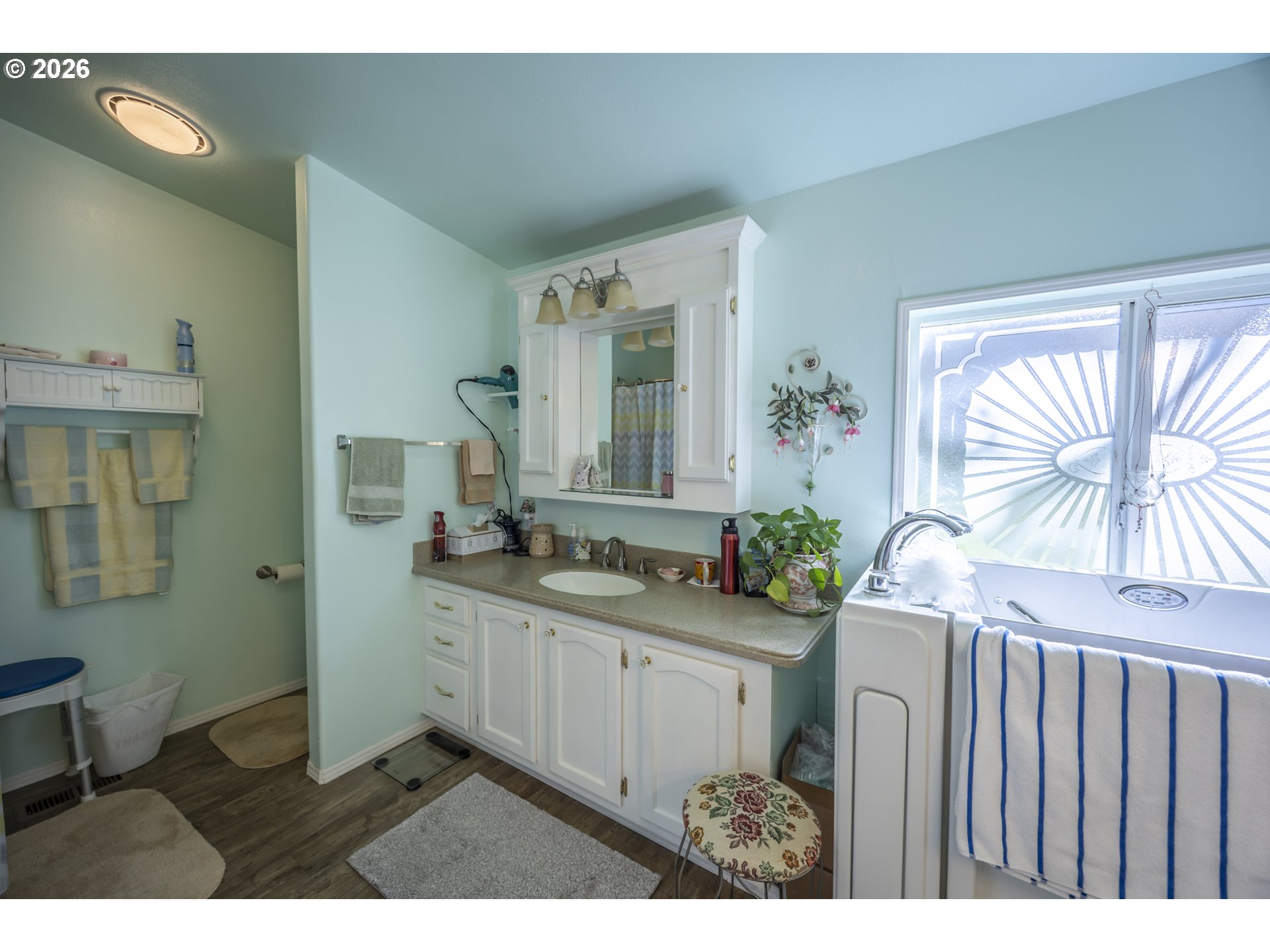 9580 North Fork Siuslaw Road Florence, OR 97439 - Photo 39 of 48 a bathroom with a sink a mirror and a window