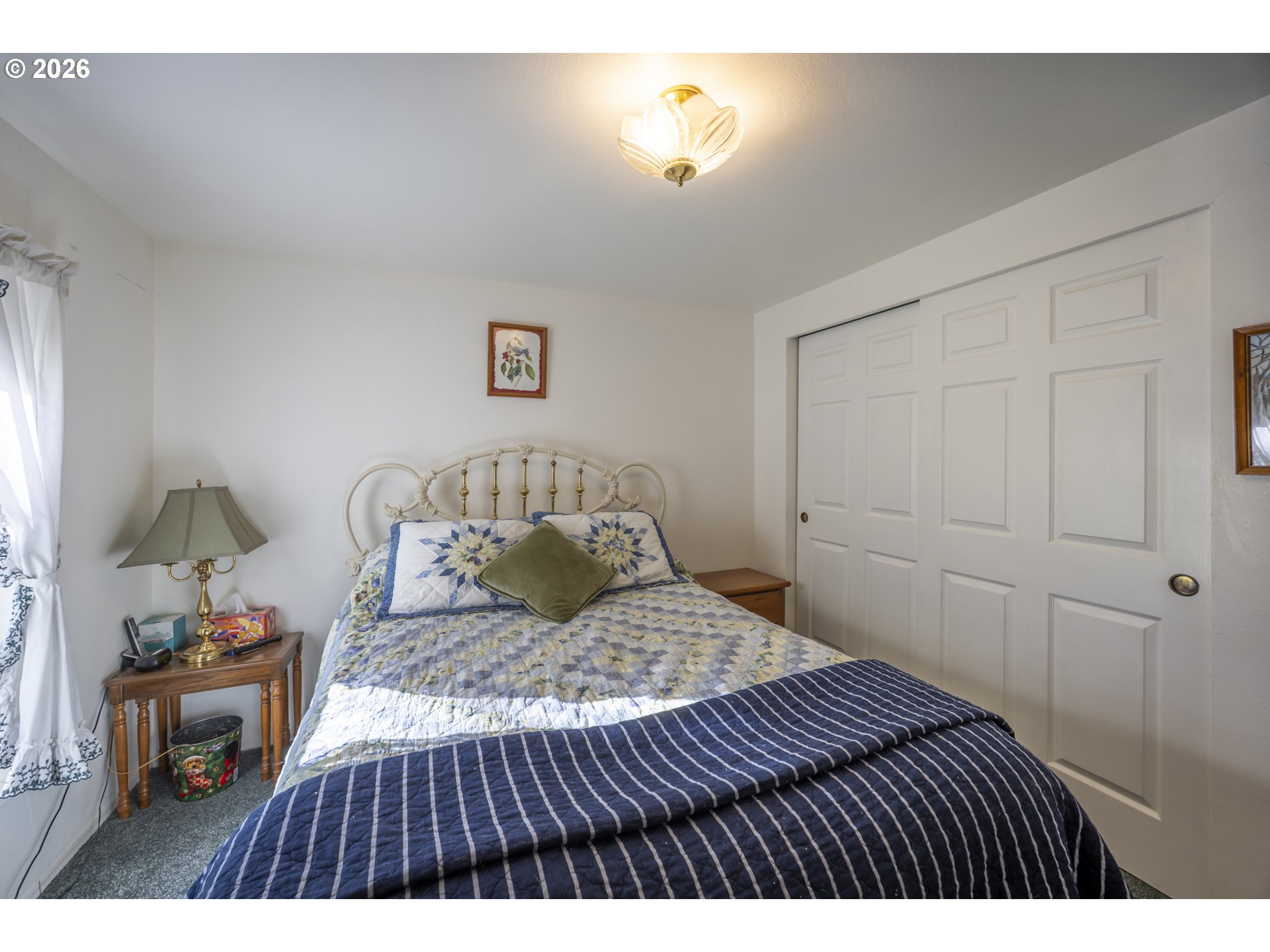 9580 North Fork Siuslaw Road Florence, OR 97439 - Photo 44 of 48 a bedroom with a bed and a window