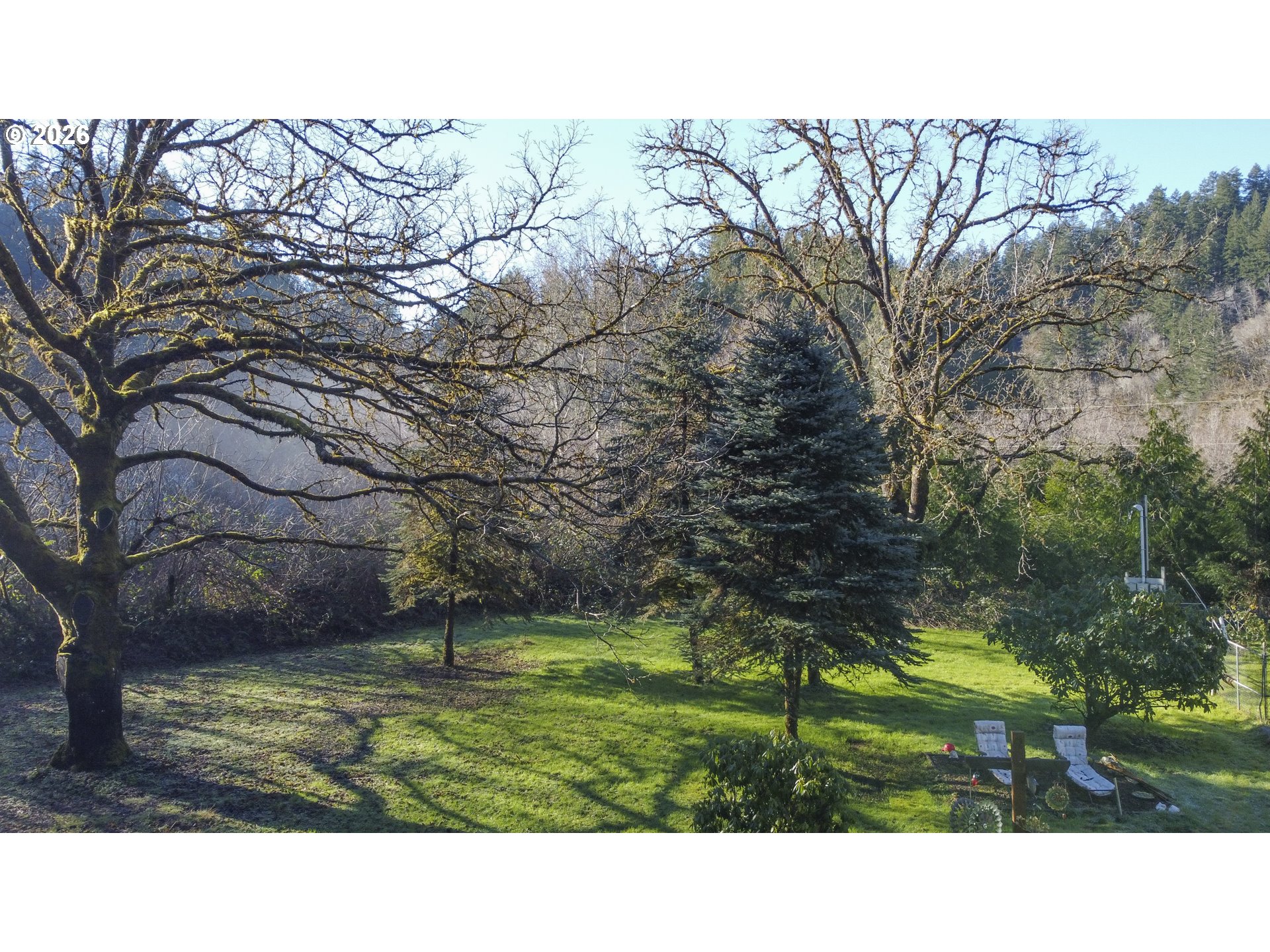 9580 North Fork Siuslaw Road Florence, OR 97439 - Photo 6 of 48 a black and white photo of a house