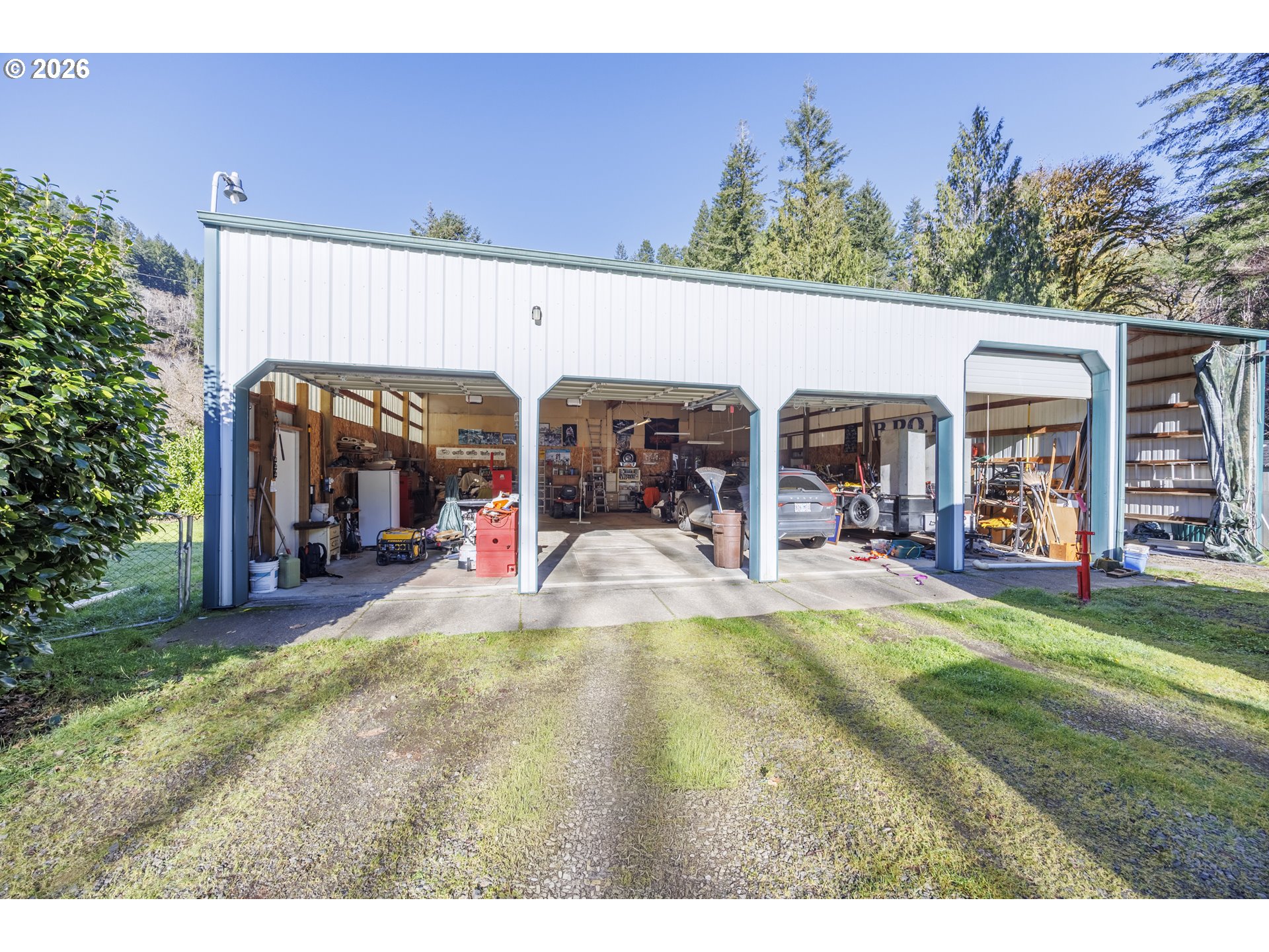 9580 North Fork Siuslaw Road Florence, OR 97439 - Photo 10 of 48 a view of a swimming pool and a chairs and tables in patio