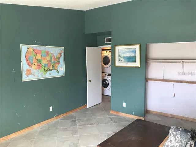 a view of a livingroom with furniture and cabinet