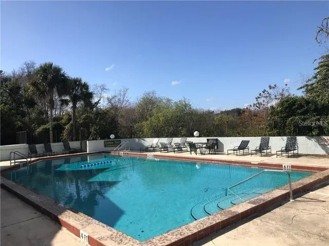 a view of a swimming pool with a patio