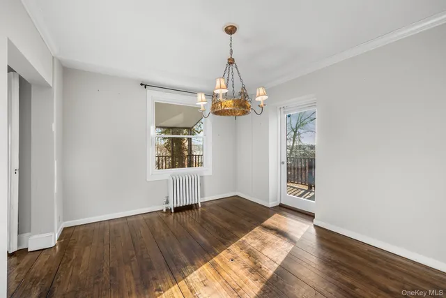 a view of livingroom with window and wooden floor