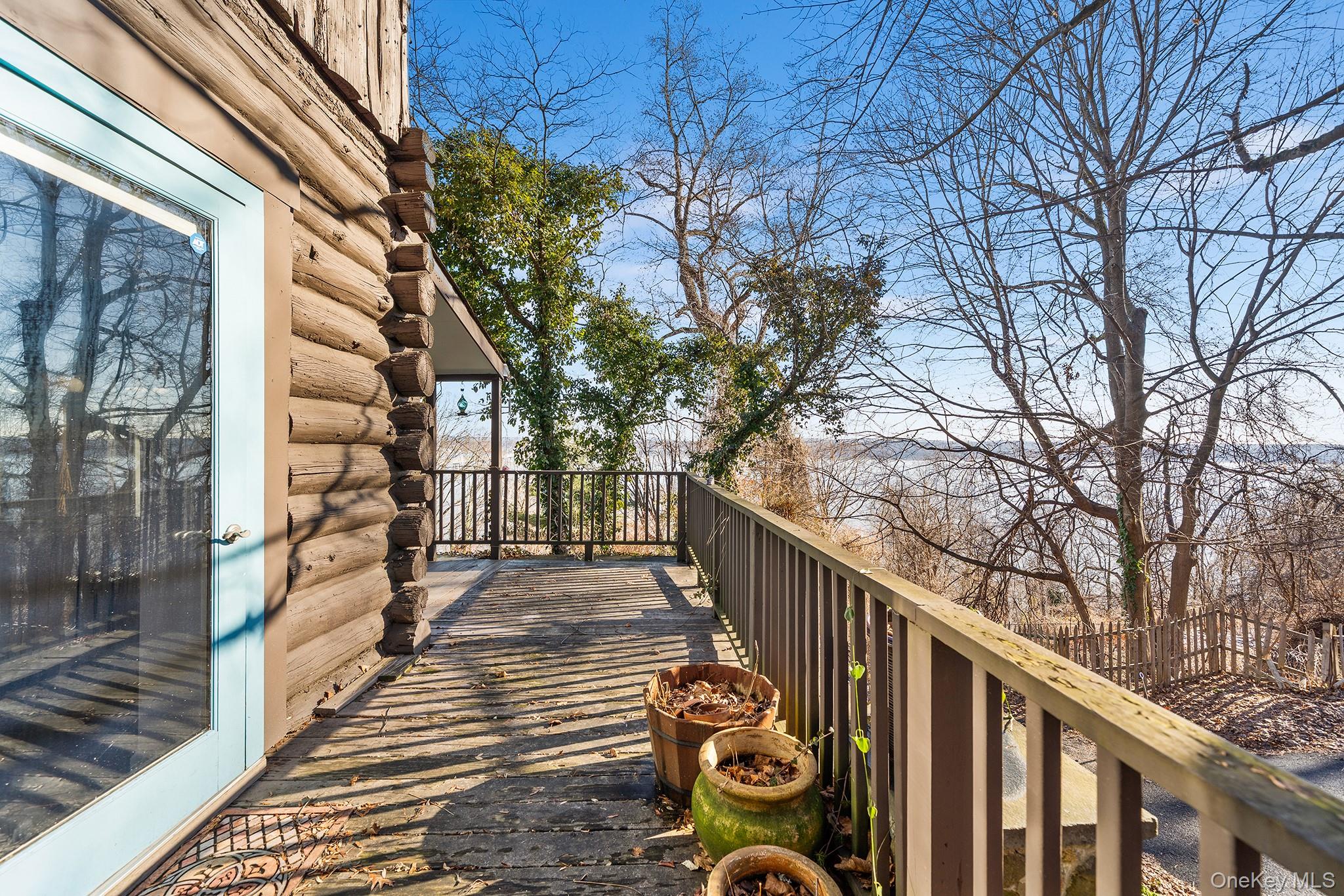 1007 Rte 9W Nyack, NY 10960 - Photo 14 of 45 a view of a balcony with wooden floor and fence