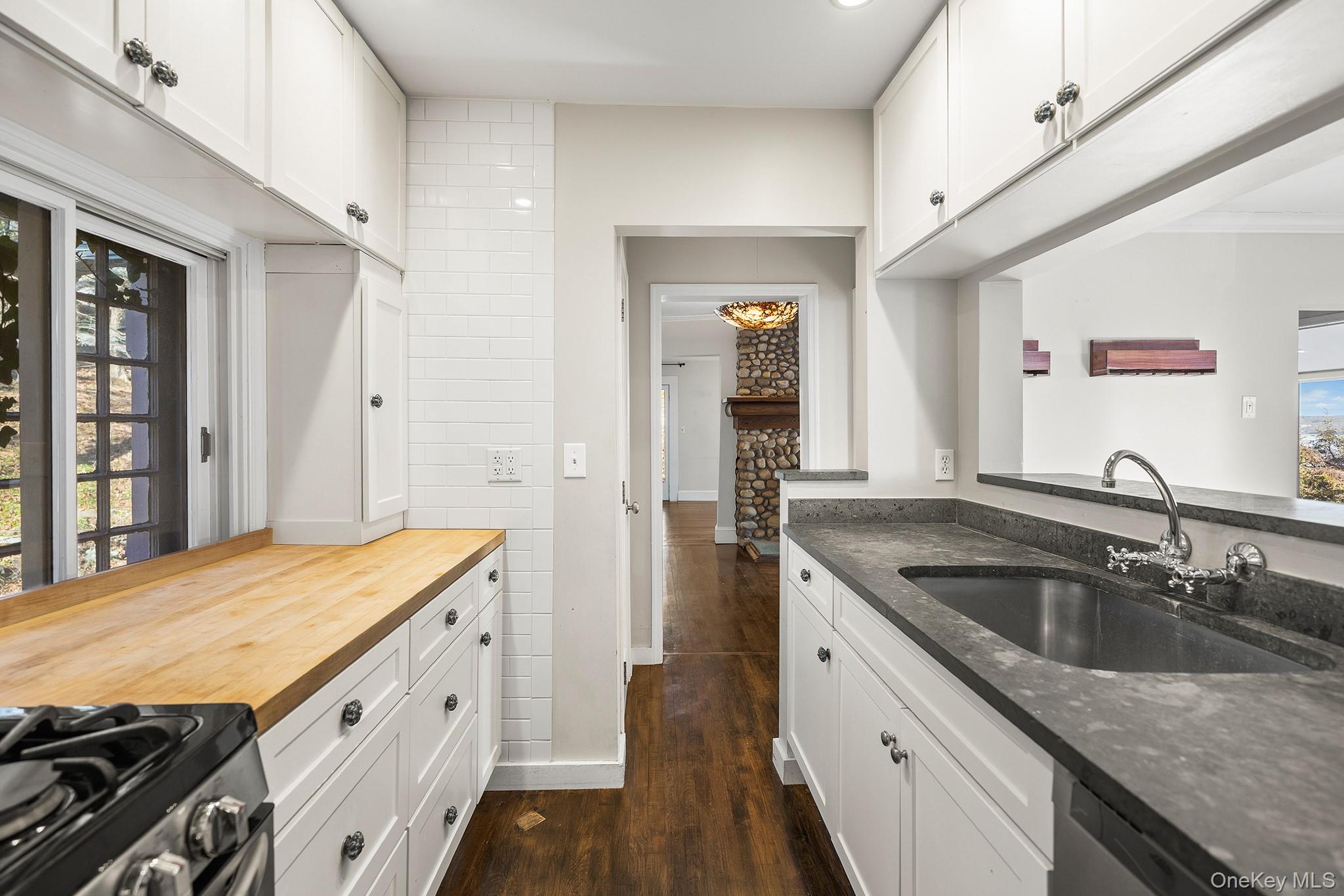 1007 Rte 9W Nyack, NY 10960 - Photo 17 of 45 a kitchen with a sink stove and cabinets