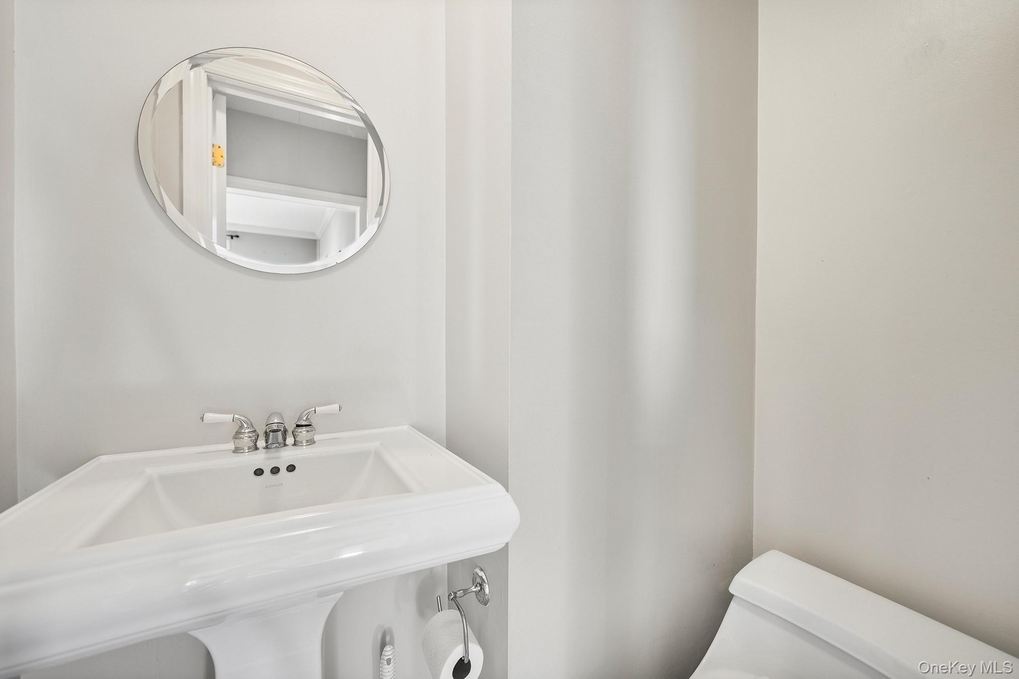 1007 Rte 9W Nyack, NY 10960 - Photo 19 of 45 a bathroom with a sink and a mirror