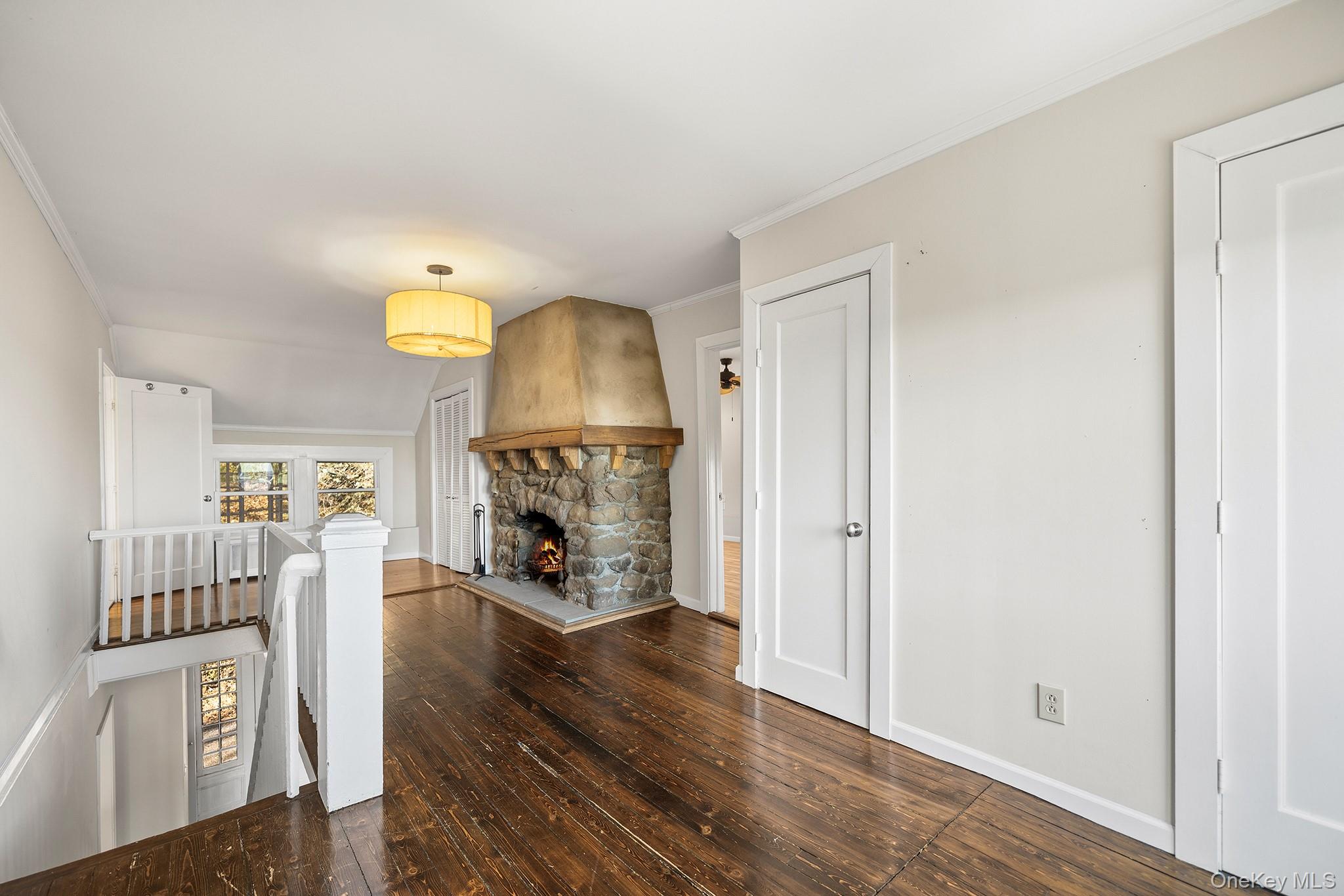 1007 Rte 9W Nyack, NY 10960 - Photo 20 of 45 a view of a livingroom with wooden floor and a fireplace
