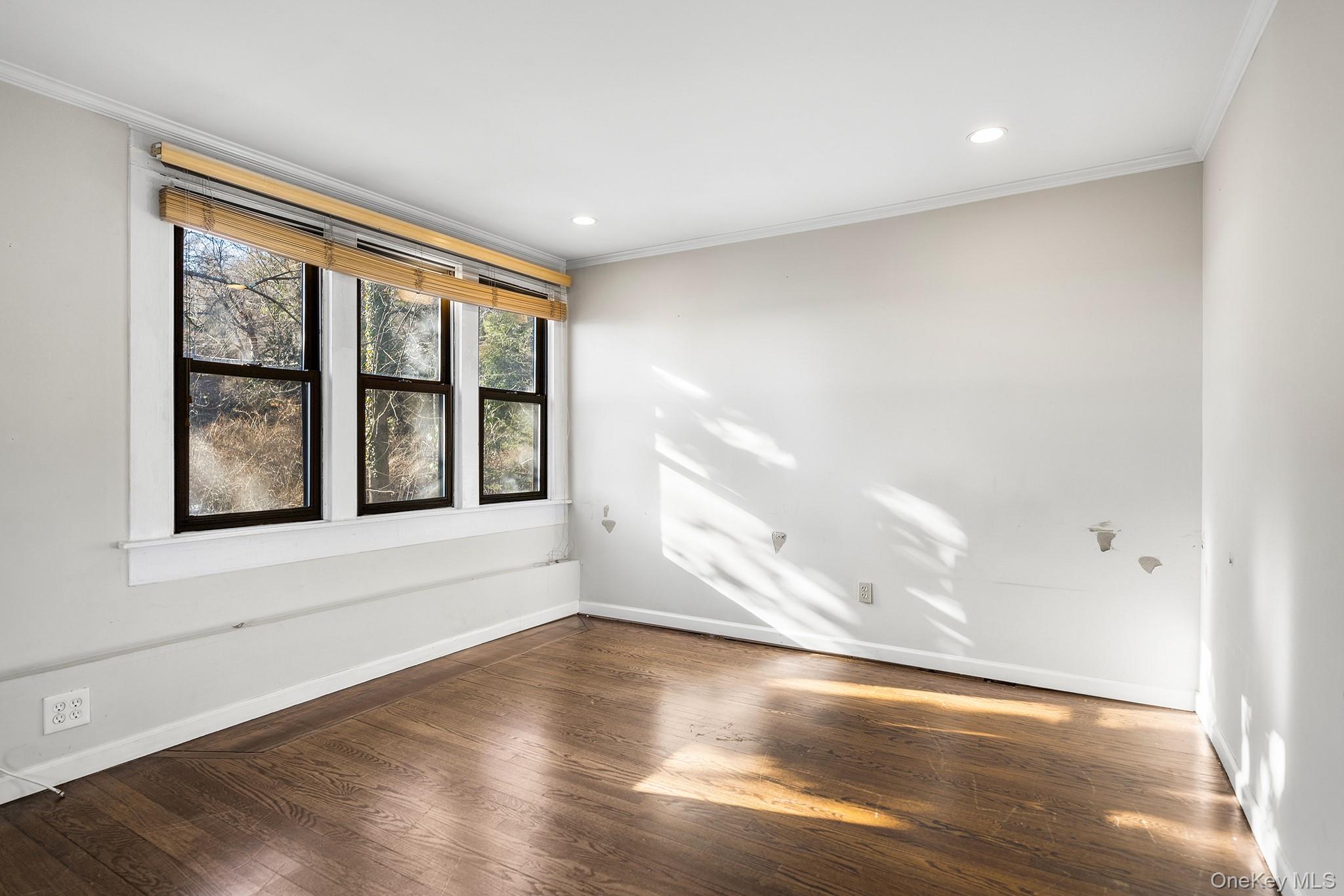 1007 Rte 9W Nyack, NY 10960 - Photo 21 of 45 a view of an empty room with wooden floor and a window