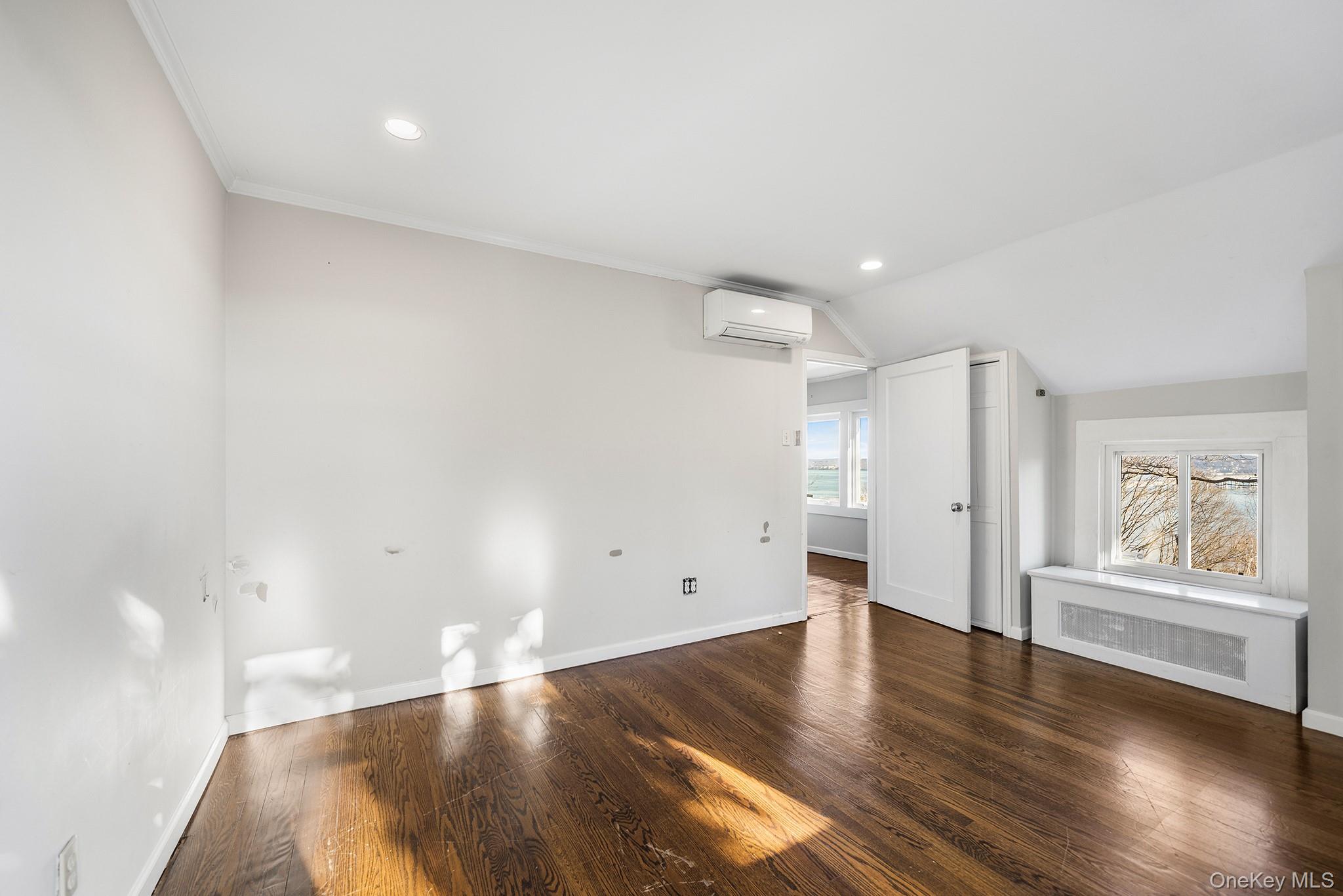 1007 Rte 9W Nyack, NY 10960 - Photo 22 of 45 a view of an empty room with wooden floor and a window