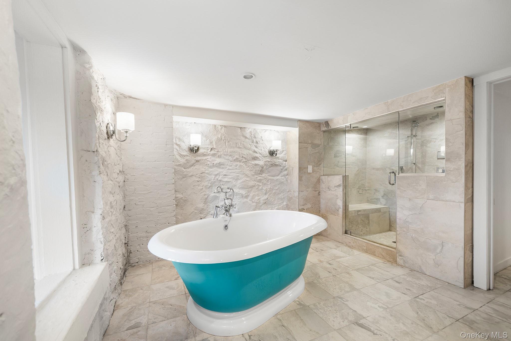 1007 Rte 9W Nyack, NY 10960 - Photo 30 of 45 a bathroom with a bathtub and shower