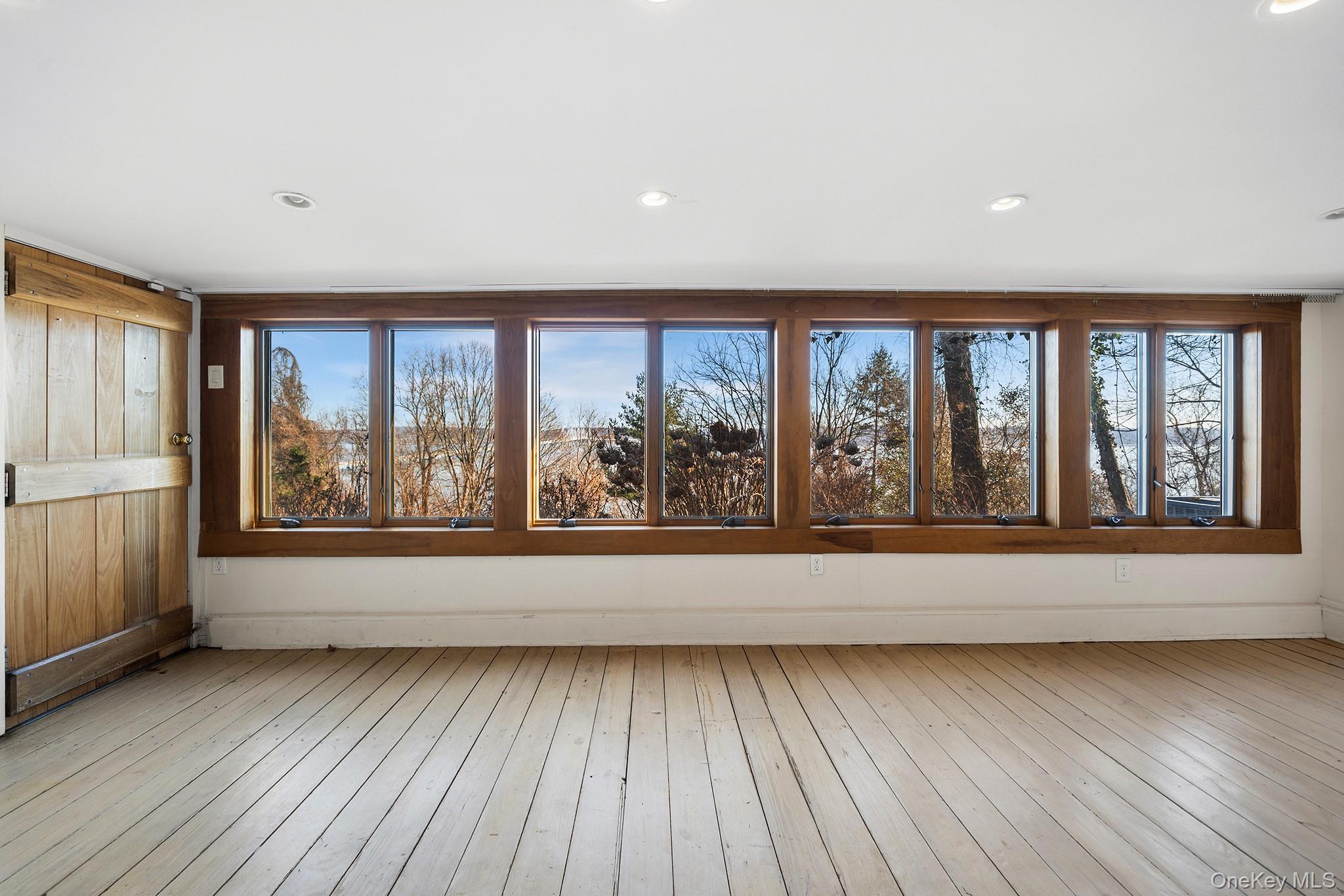 1007 Rte 9W Nyack, NY 10960 - Photo 34 of 45 wooden floor in an empty room with a window