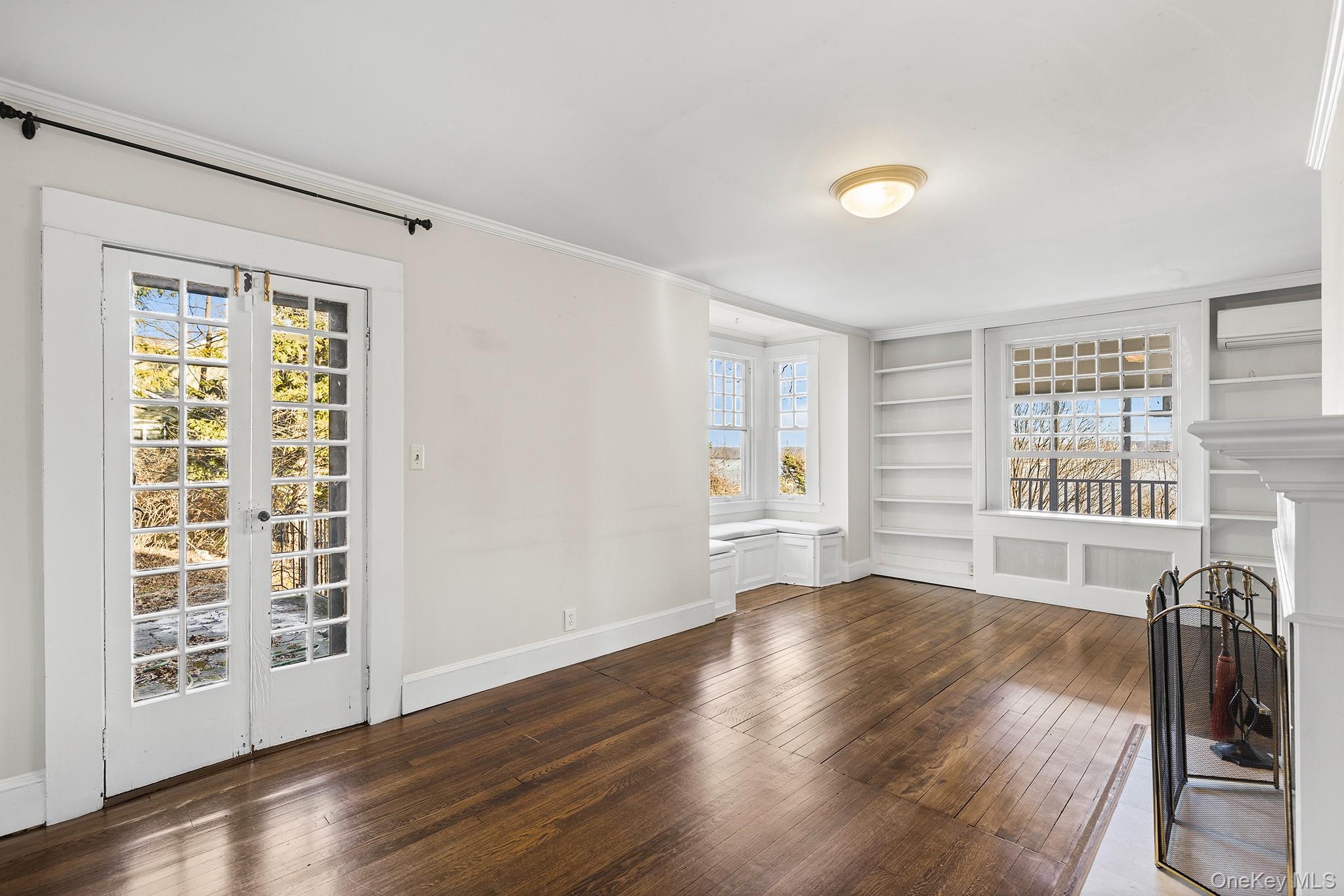 1007 Rte 9W Nyack, NY 10960 - Photo 5 of 45 a view of an empty room with wooden floor and a window