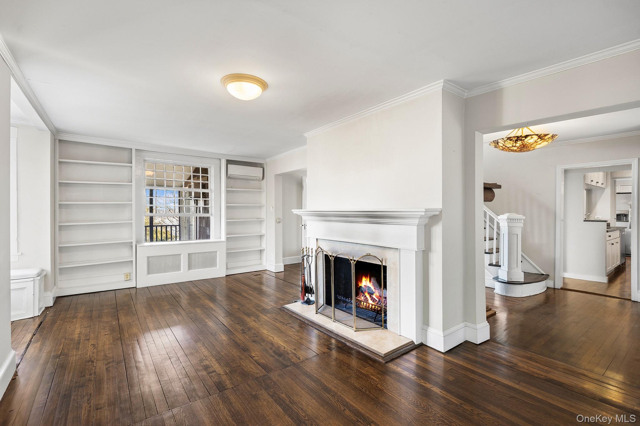 1007 Rte 9W Nyack, NY 10960 - Photo 6 of 45 a view of an empty room with a fireplace and a window