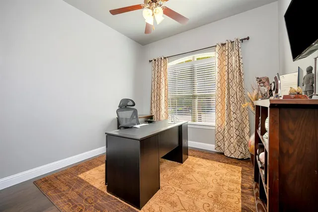 a view of workspace with wooden floor