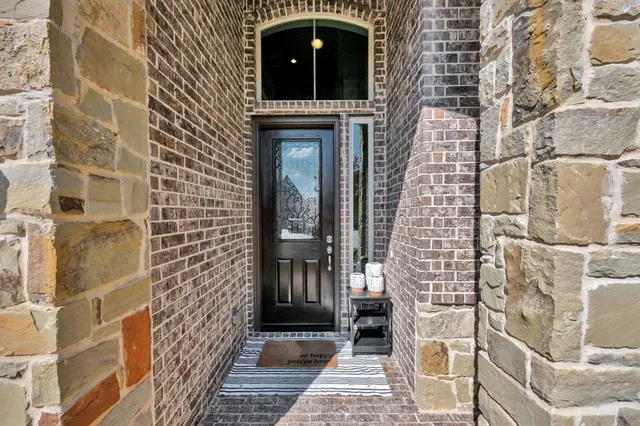 a view of a brick house with an outdoor space