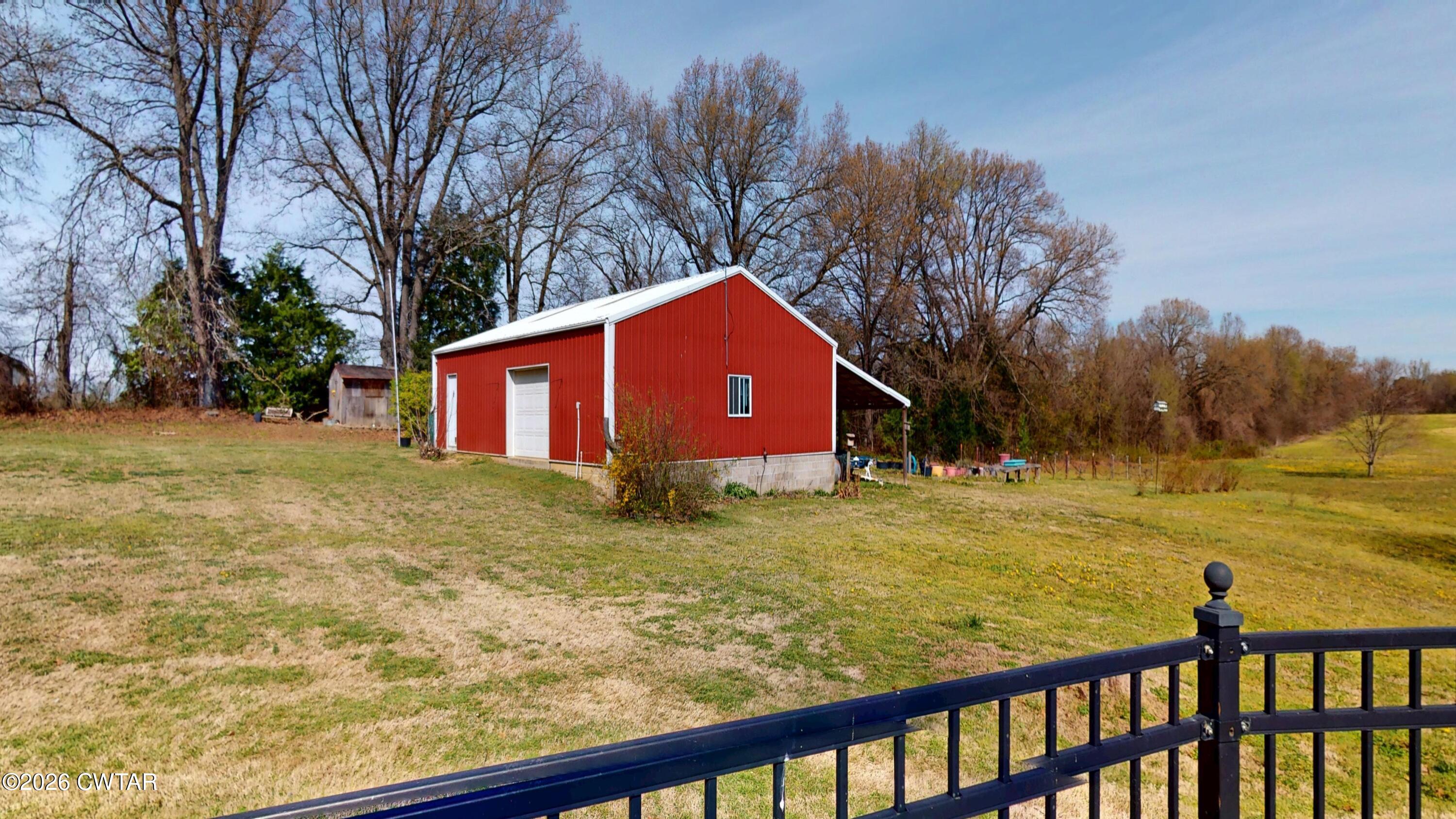 740 Gordon Road Dyersburg, TN 38024 - Photo 41 of 48 a view of a house with a yard