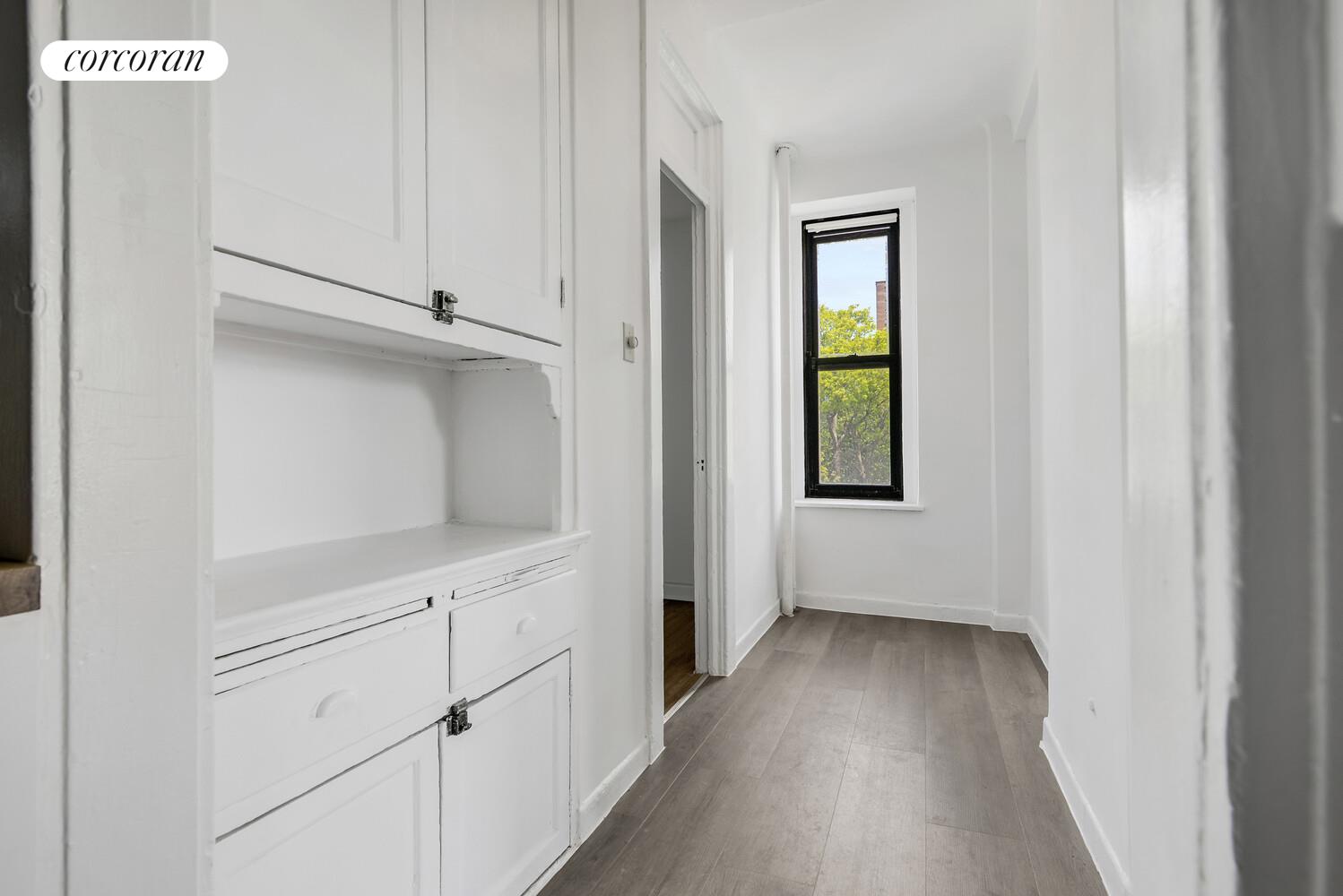 409 Edgecombe Avenue, Unit 2A Manhattan, NY 10032 - Photo 12 of 19 a view of a hallway with wooden floor and closet