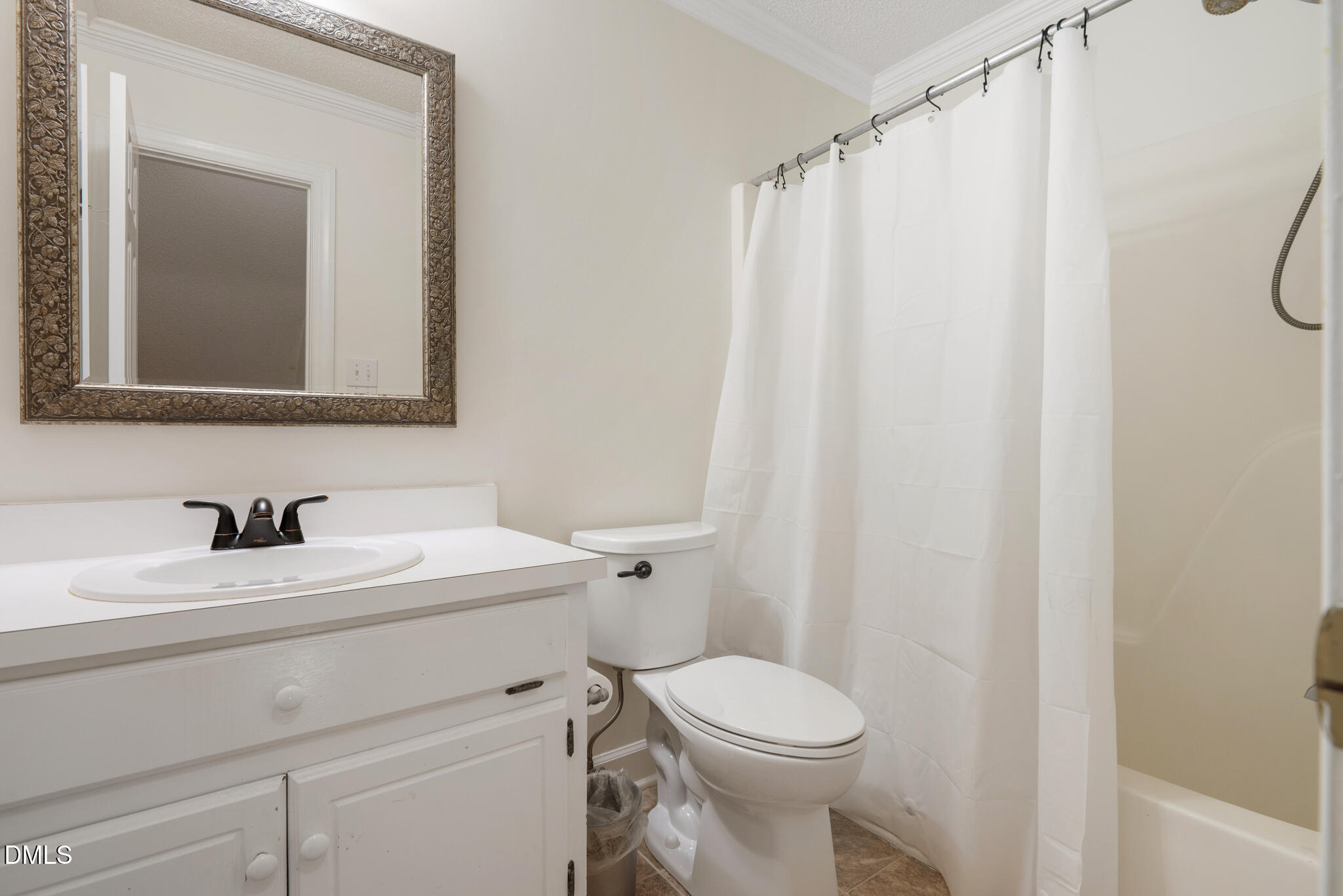 4712 Forest Highland Drive Raleigh, NC 27604 - Photo 34 of 53 a bathroom with a sink a toilet and a mirror