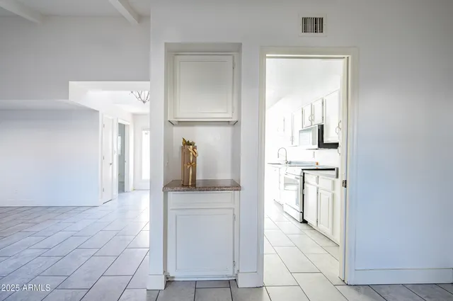 a view of a swimming pool with a lounge chairs