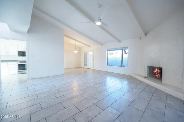 a view of an empty room and window