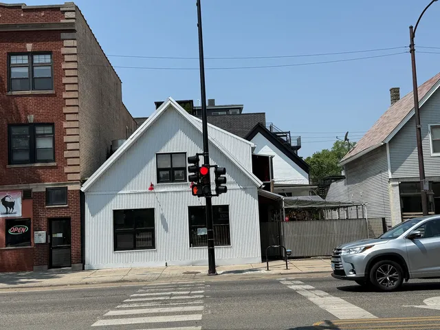 a view of a car park in front of house