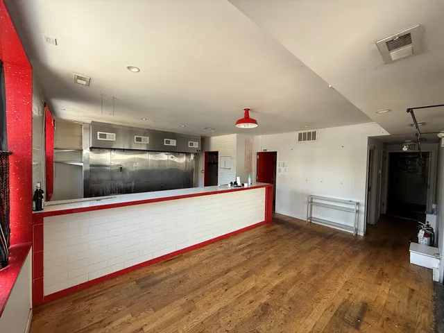 a kitchen with stainless steel appliances a refrigerator and a sink