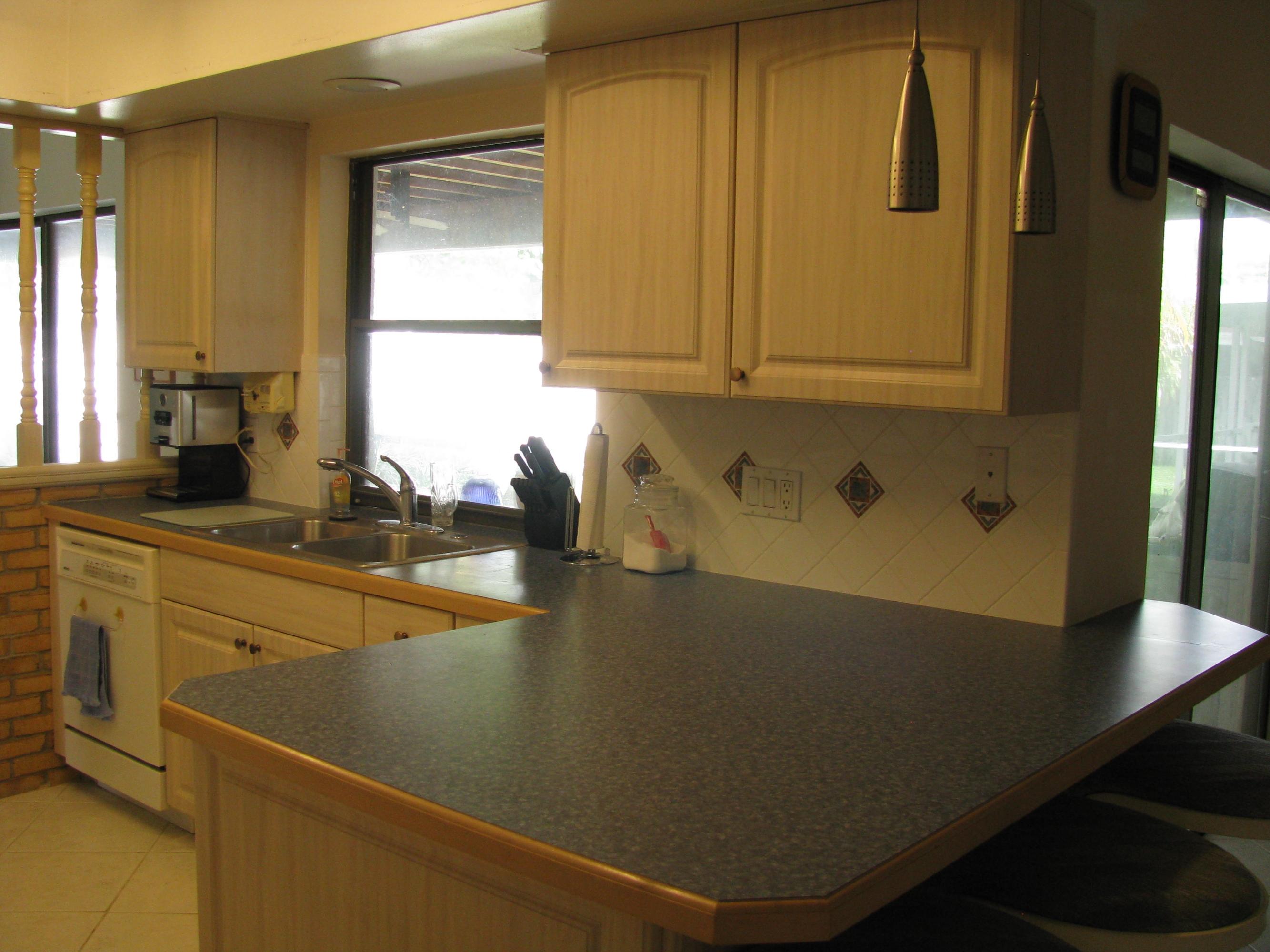 4917 Bimini Road Tequesta, FL 33469 - Photo 21 of 53 view of kitchen to patio