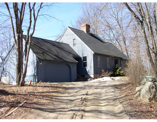 85 Adams Road Grafton, MA 01536 - Photo 1 of 1 a view of a house with snow on the road