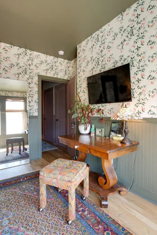 a living room with a flat screen tv and a fireplace