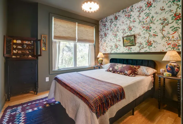 a bedroom with a bed and a window