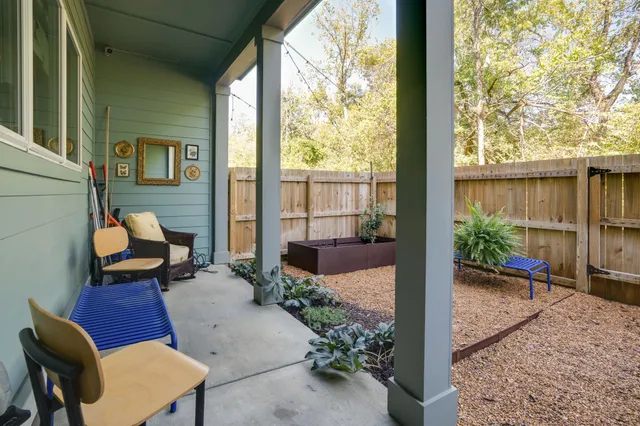 a view of two chairs in the balcony