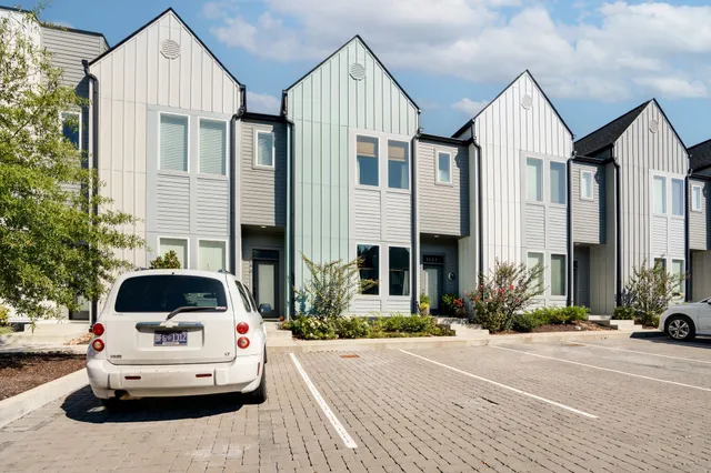 a car parked in front of a house
