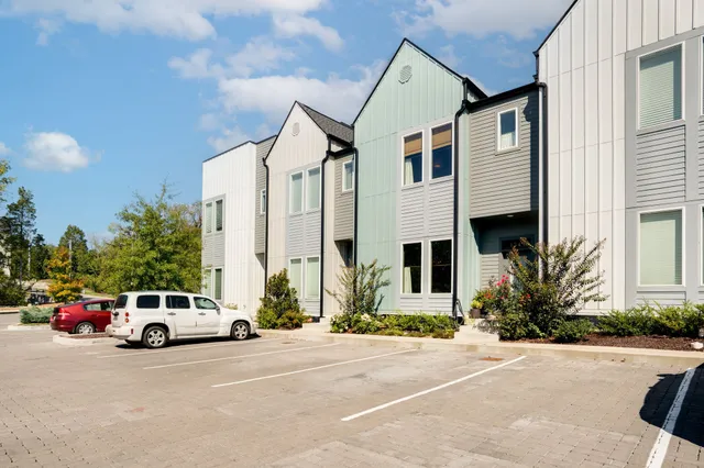 a view of a city street with tall buildings