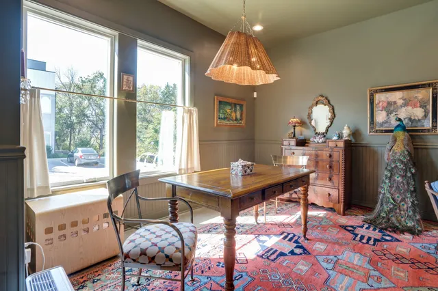 a view of a dining room with furniture window and outside view