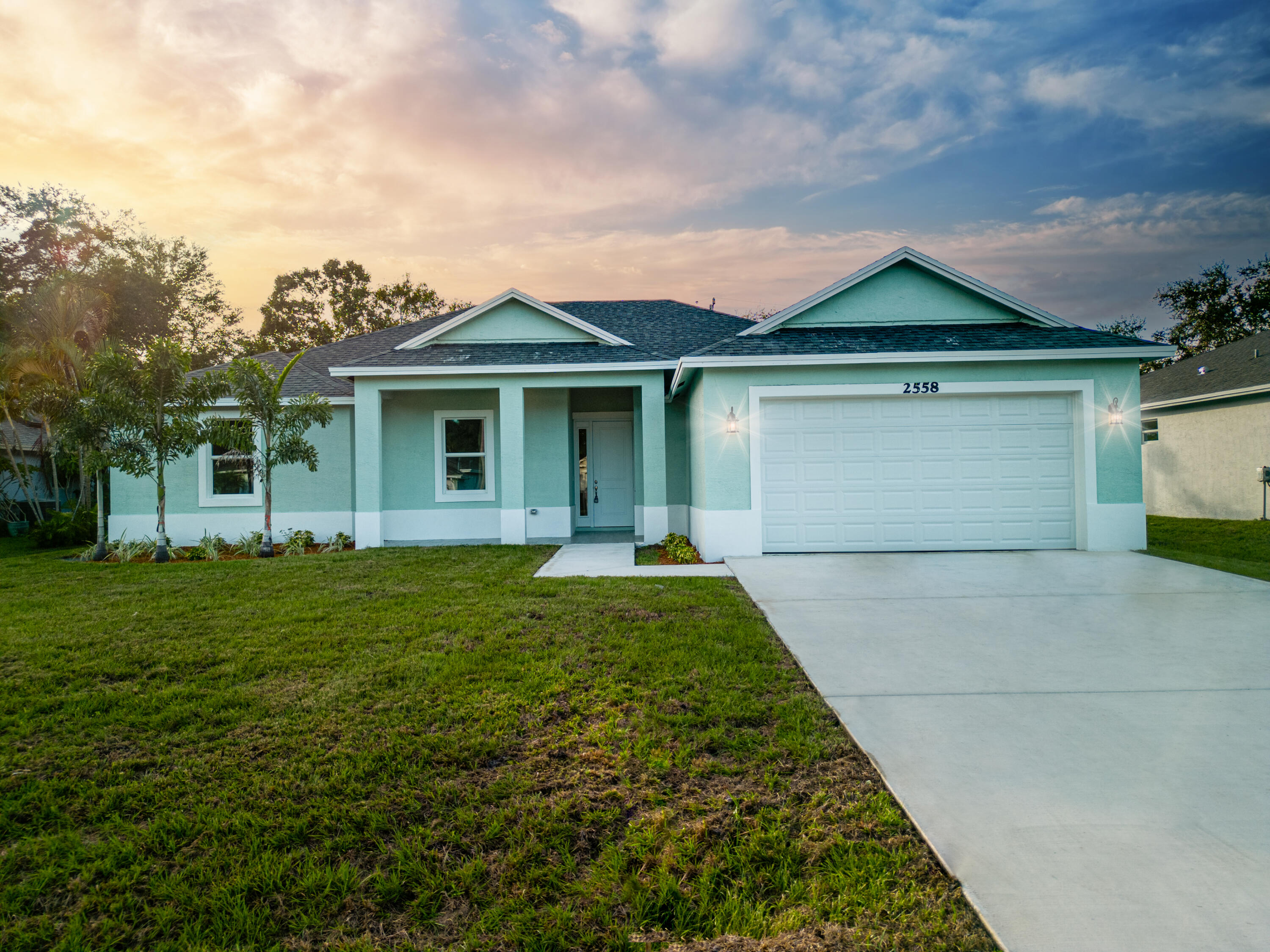 5519 Northwest Downs Street Port St. Lucie, FL 34986 - Photo 1 of 22 a front view of a house with a yard