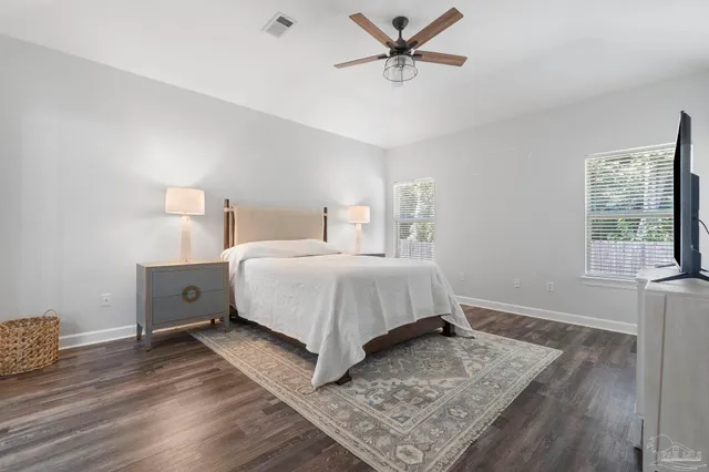 a bed room with a bed and a window