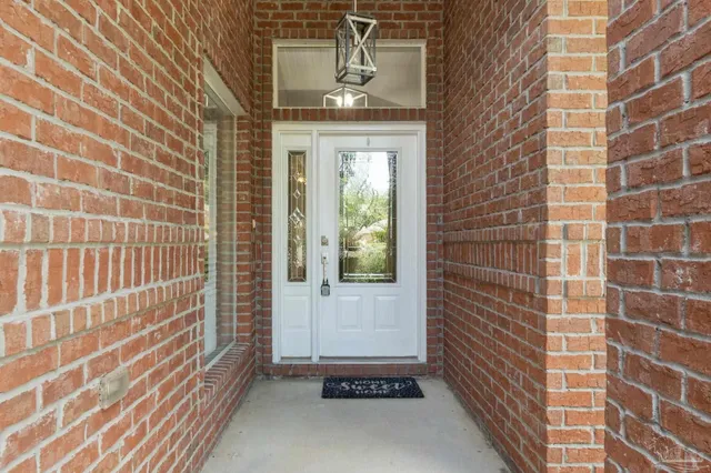 a view of a door and a window