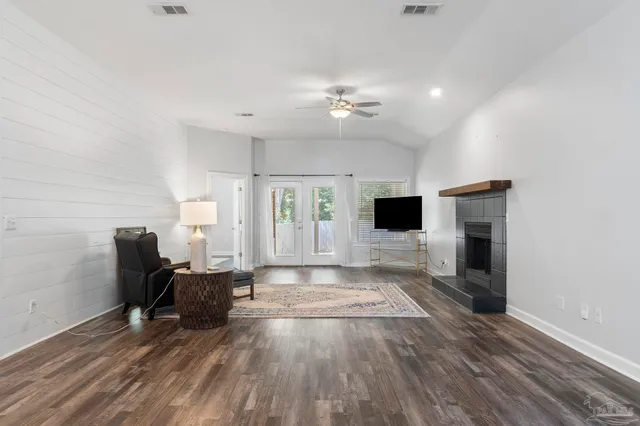 a living room with furniture and a fireplace