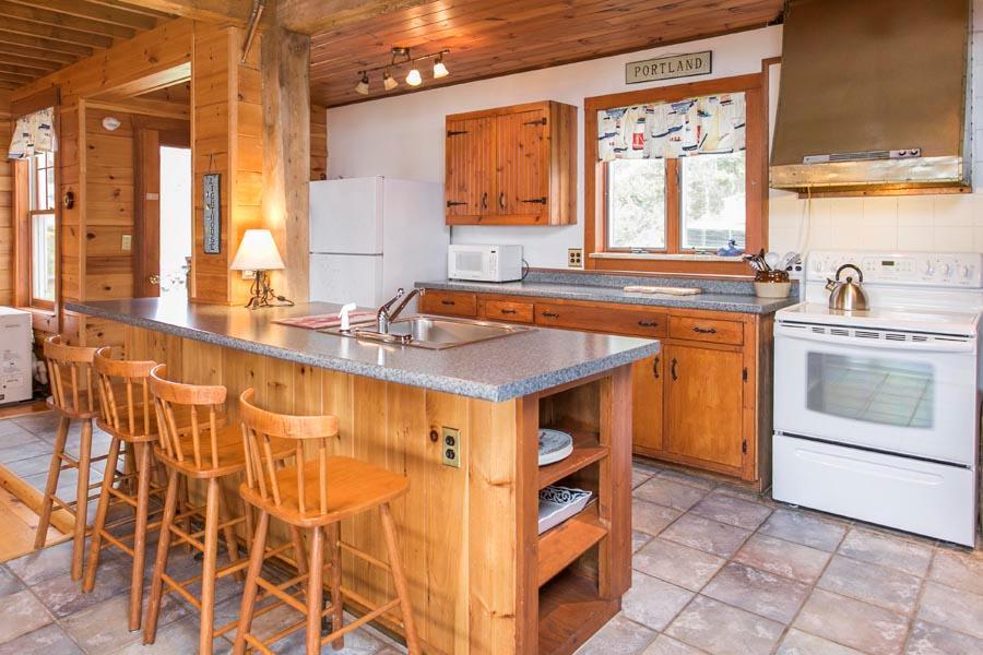 22 Spring Street East Boothbay, ME 04544 - Photo 5 of 27 The kitchen, with wood cupboards...