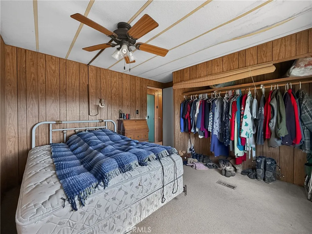 230 Patterson Road Rosamond, CA 93560 - Photo 16 of 18 a bed room with a bed and a walk in closet