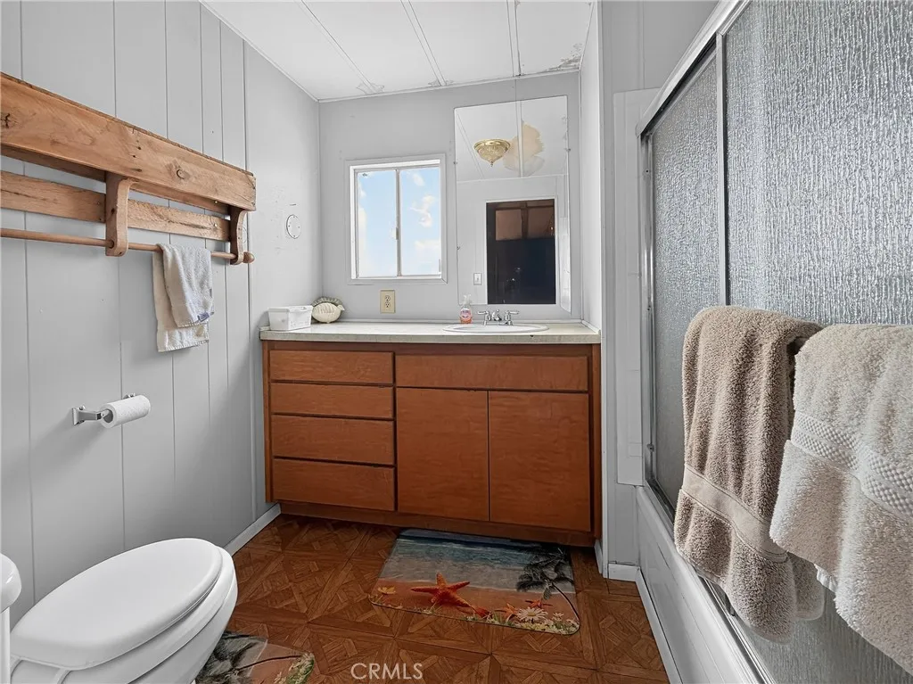 230 Patterson Road Rosamond, CA 93560 - Photo 17 of 18 a bathroom with a sink a toilet and shower