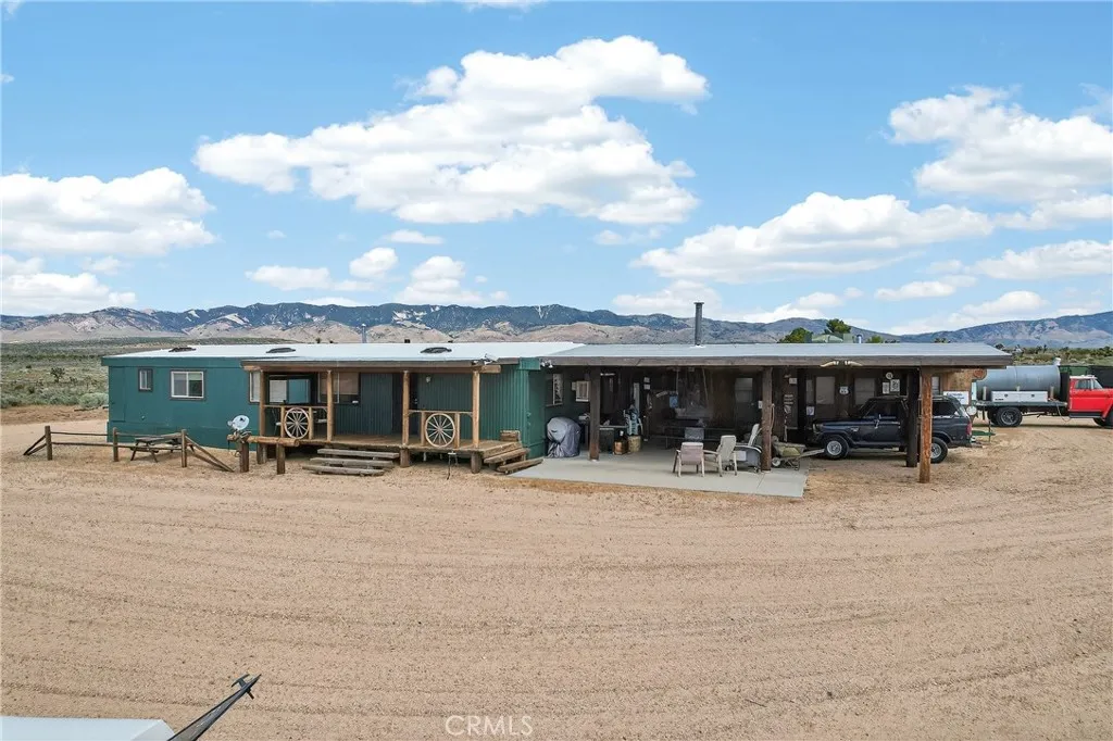 230 Patterson Road Rosamond, CA 93560 - Photo 4 of 18 a view of a house with patio