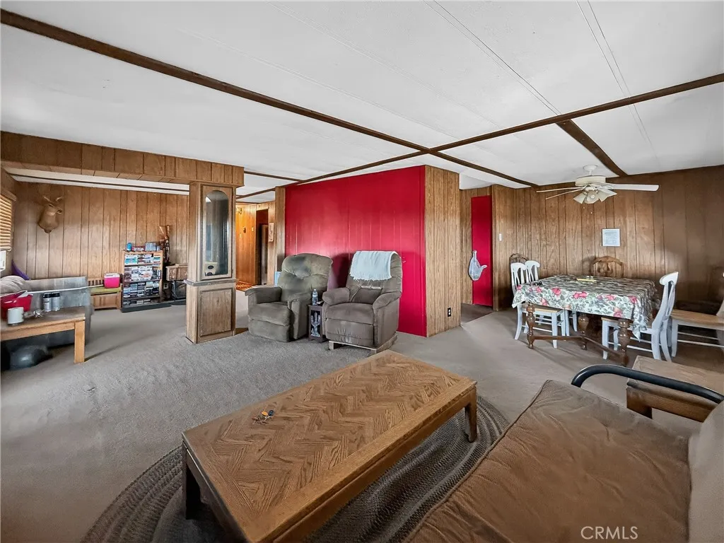 230 Patterson Road Rosamond, CA 93560 - Photo 9 of 18 a living room with furniture a air conditioner and a table