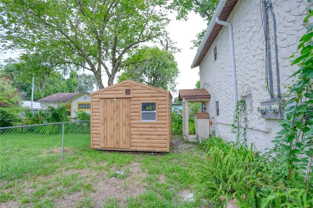a backyard of a house with lots of green space