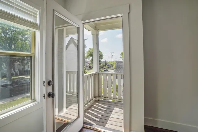 a view of a glass door and the balcony